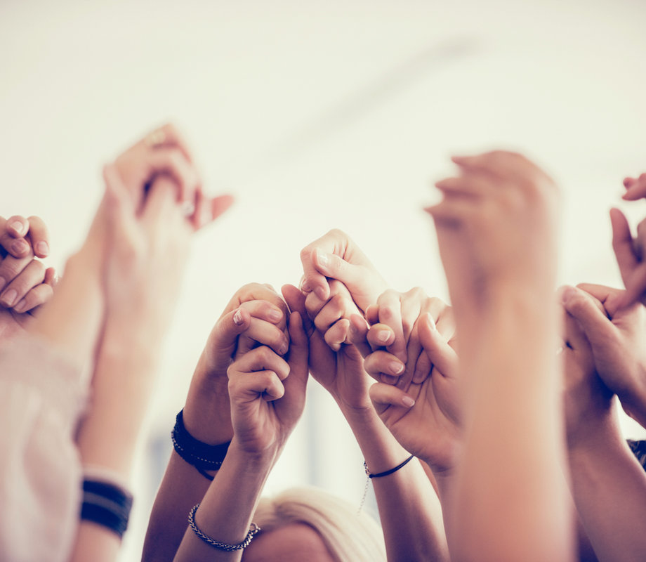Women holding hands representing caregiver education